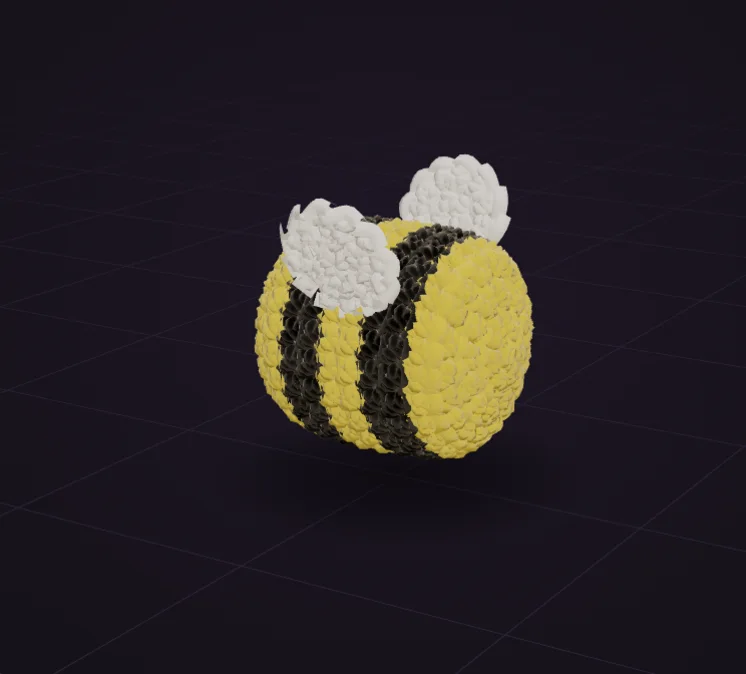 The finished bee in the 3D view: a yellow and black striped body with two small white wings placed on its back.